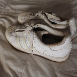 White women’s Adidas sneakers